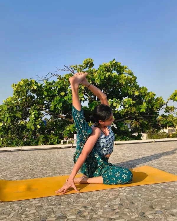 Welcome. My practice is about finding strength and grace, whether on a sunny rooftop or in your living room. I believe yoga is a personal journey, and I'm here to guide you in discovering what it means for you.