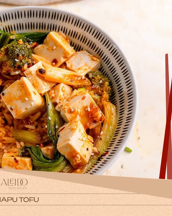 My Mapo Tofu is a vegetarian showstopper. I use house-made silken tofu and fresh greens like bok choy, all tossed in a rich and spicy Sichuan sauce.