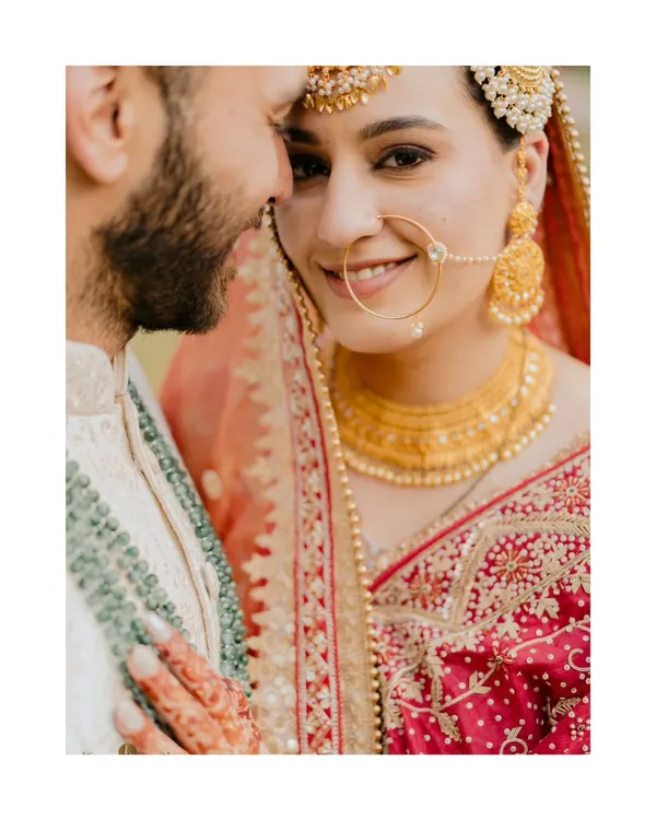 A quiet moment of connection on the wedding day. We believe the most powerful stories are told in the glances shared between two people, and this frame captures the pure, unspoken love between Arsh and Pratham.