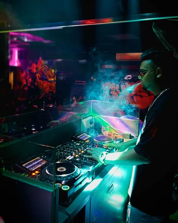 In my element, controlling the vibe of the room from behind the decks. This is where I blend tracks and build the energy for the night.