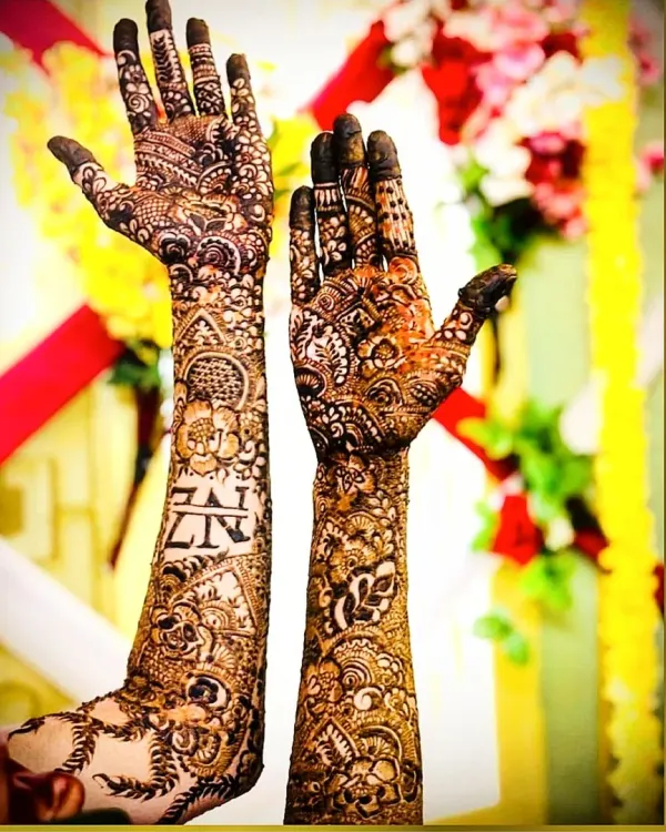 The letters 'ZN' for the bride and groom are woven right into the fabric of this full bridal design. This is my favorite way to make your henna truly one of a kind.