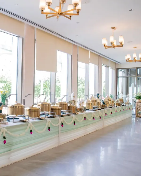 A glimpse into the grandeur I bring to your events with an expansive and elegant buffet setup, featuring my signature golden serveware. This display was for a traditional Ayushya homam puja, blending sophistication with classic style.