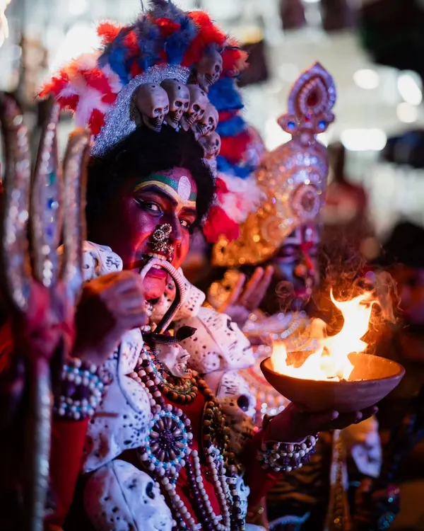 A powerful close-up of an artist portraying the goddess Kali. I focused on the intense expression and the dramatic fire element to capture the raw energy of the performance.