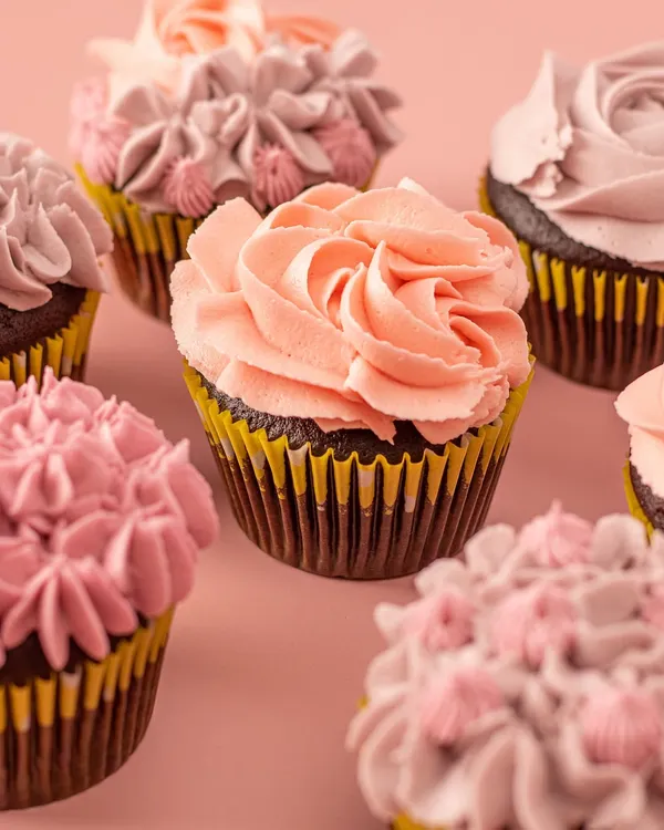 No words needed, these treats speak for themselves. My Belgian chocolate cupcakes are topped with irresistible vanilla buttercream frosting, perfect for brightening up any day.