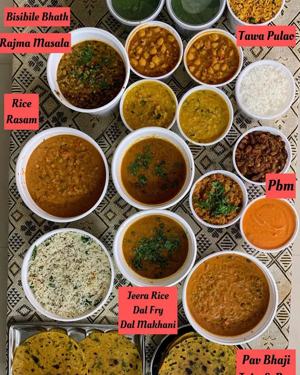 A look at a large meal prep for a get together and for dehydration. The spread includes BisiBile Bath, Rajma Masala, Dal Makhani, Pav Bhaji, and more, all made fresh.