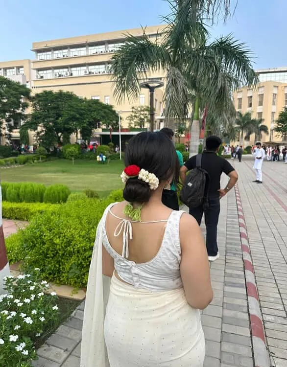 A client looking absolutely stunning with my reusable crochet gajra in her hair. It's the perfect accessory for traditional wear, adding a touch of handmade elegance.
