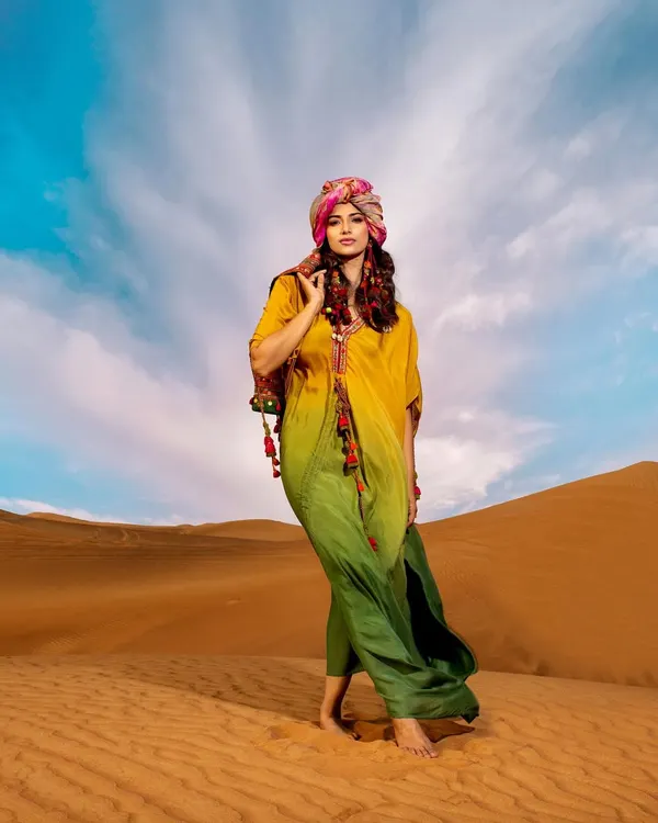 This editorial shot from a desert series captures the "habibi vibes" I love to create. Styling a vibrant, flowing kaftan against the dramatic dunes shows how I build a story and a mood, not just an outfit.