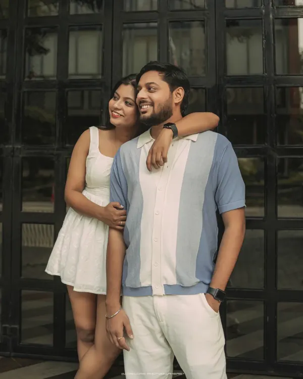 A relaxed and stylish portrait against a modern, graphic background. This shot captures the cool, contemporary vibe of an urban couple shoot in Bangalore.