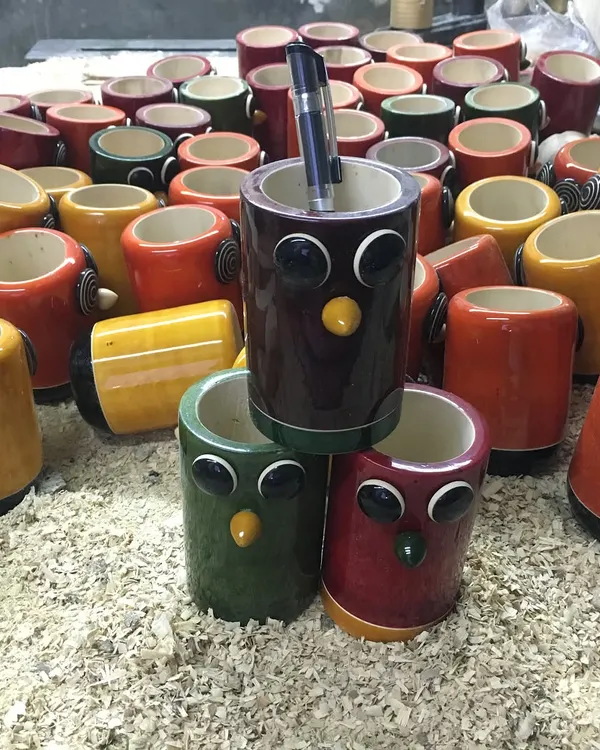 Our owl-themed pen holders are a popular choice for office and home decor. Available in a variety of rich, organic colors, they add a touch of handcrafted charm to any desk. Each piece is turned from a single block of wood.