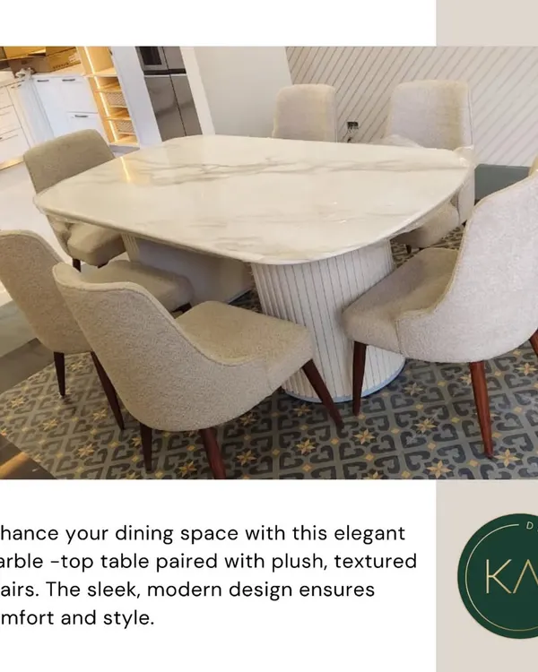 We designed this elegant dining set featuring a freeform marble-top table on a fluted pedestal base. The plush, textured chairs provide exceptional comfort, making this set a perfect blend of modern design and style for any dining space.