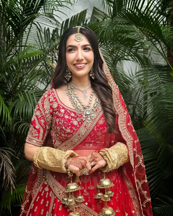 A vision in red and gold, this bridal look is the essence of timeless tradition. I focused on creating a radiant, flawless base that glows, paired with soft, defined eyes and a classic red lip to complement the magnificent lehenga. This is about making a grand, yet elegant statement.
