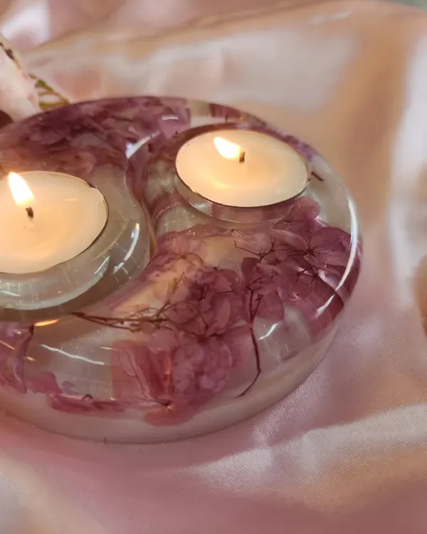 Shipping this beauty to New Delhi today. This is a close-up of the pearl white and pink flower resin tealight holder, with the candles lit. It gives off such a warm, beautiful light.
