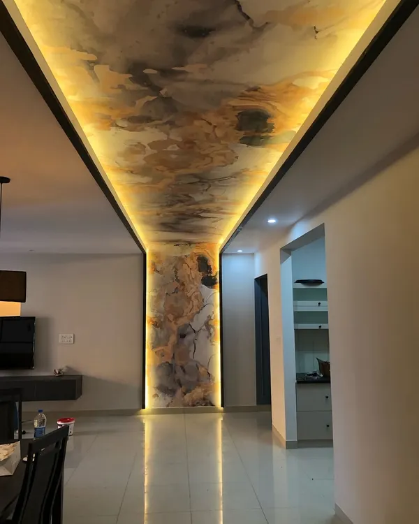 This backlit ceiling and pillar installation creates a stunning, continuous flow of abstract art, turning a simple hallway into a high-end feature. It shows my expertise in handling complex surfaces and integrating lighting for a dramatic effect.