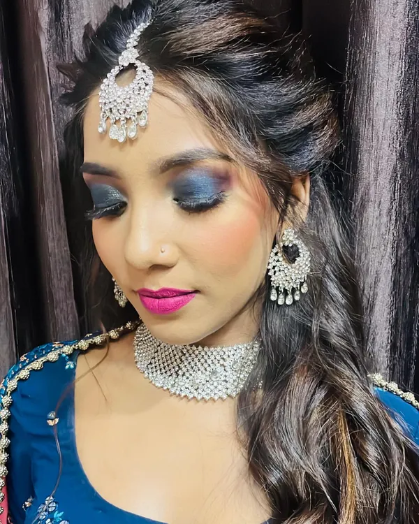 This is a stunning reception makeup look created by one of my students. In my Professional Makeup Artistry course, you will learn how to master techniques like this dramatic blue smokey eye, flawless base application, and color theory to create bold and beautiful looks for any occasion.