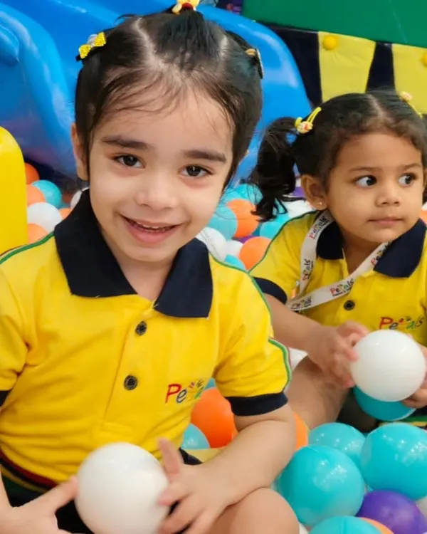 We love seeing the pure joy on kids' faces during their school picnics. This student from Petals Pre School is having a wonderful time in our massive, colorful ball pit.