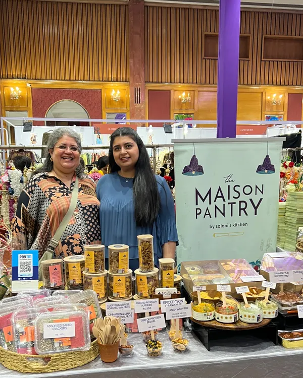 Posing proudly at my stall during the Jalsa exhibition. It brings me so much joy to stand behind my creations and share them with everyone who visits.