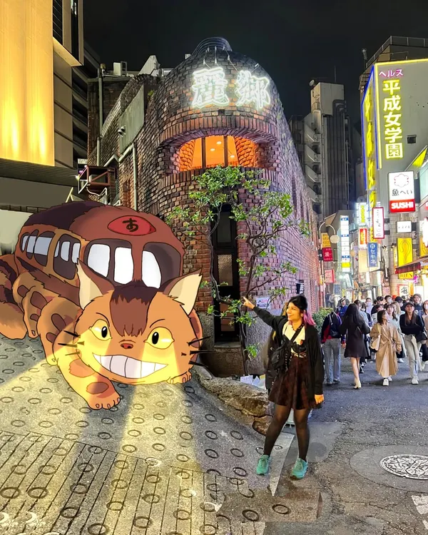 Here I am in Japan, with the Catbus from 'My Neighbor Totoro' illustrated right onto the street. This is how I combine my love for travel, art, and anime.