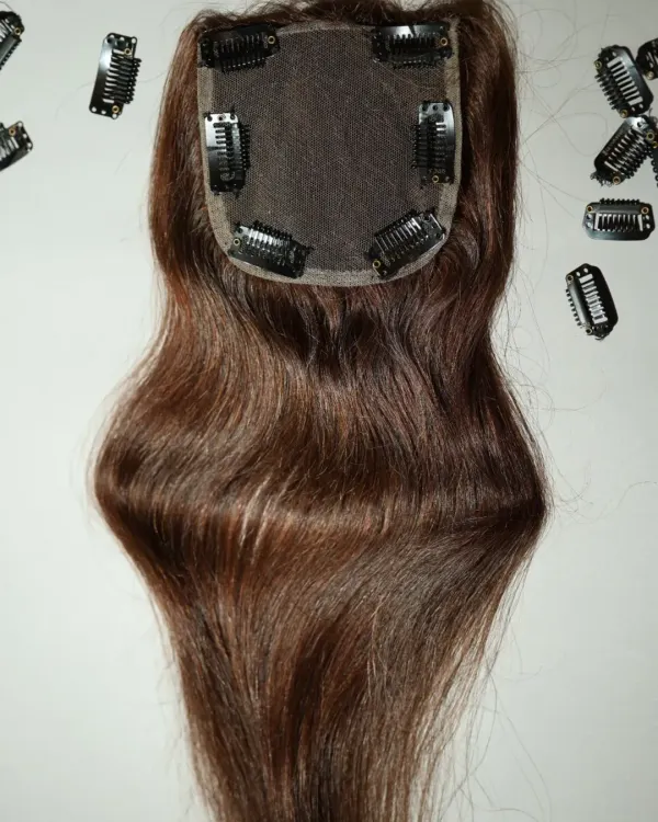 This is a close-up of one of my hair toppers, designed to give you confidence starting from the crown. You can see the secure clips and the natural-looking scalp base.