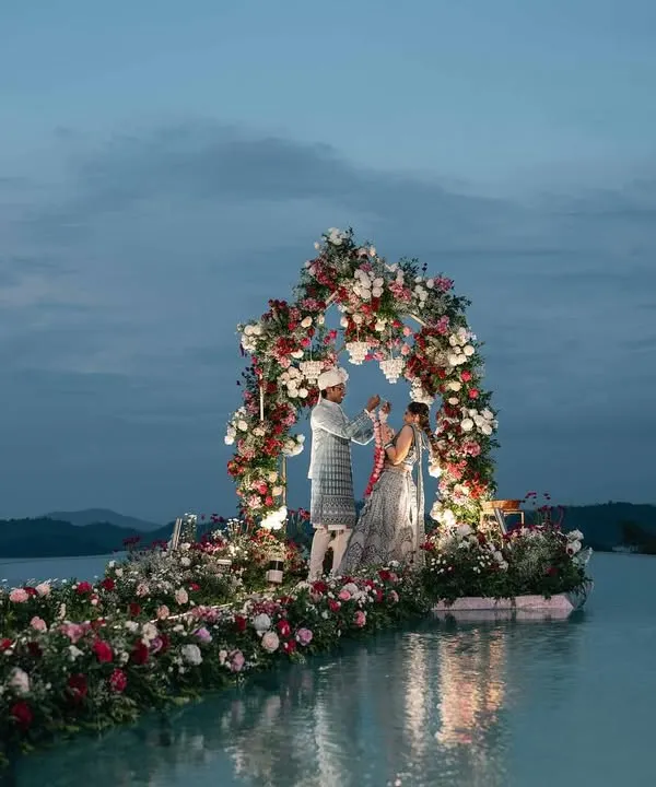 For a truly magical Varmala, we set up this breathtaking floral arch right in the middle of an infinity pool. Overlooking misty mountains at sunset, it was a moment straight out of a fairytale, showcasing our love for creating spectacular destination wedding experiences.