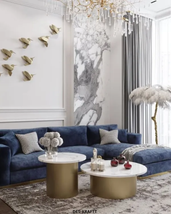 This luxurious living room is the perfect blend of comfort and opulence. We used a rich, deep blue velvet sectional as a bold centerpiece, complemented by brushed gold accents and dual marble coffee tables to create a space that is both inviting and undeniably sophisticated.