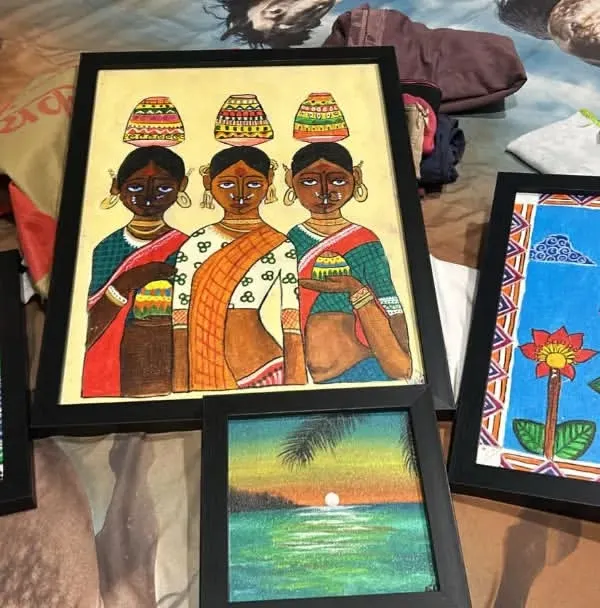 A collection of framed Madhubani paintings on canvas by Adhya, an 11th standard student. Her work includes traditional motifs like fish, lotuses, and working women, all done in the authentic folk style.