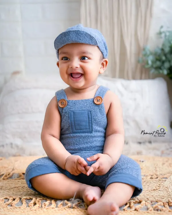 That pure, joyful, open-mouthed laugh. This is what milestone sessions are all about. Capturing the happiness of a baby who has just discovered the world.