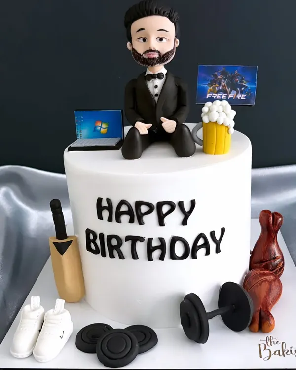 How well do you know your husband's hobbies? This cake tells a whole story, with edible toppers representing everything he loves: cricket, fitness, gaming, and work.