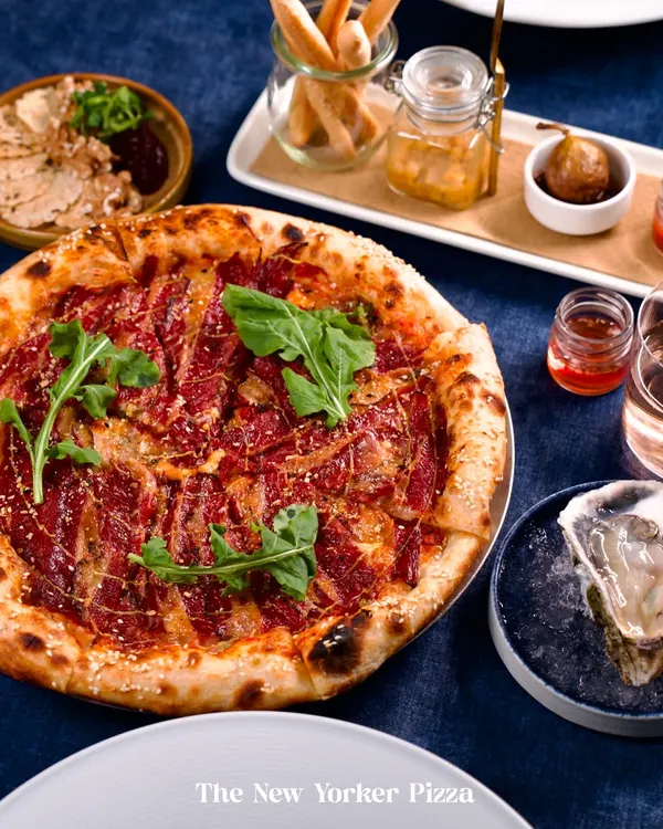 A true feast. Our Neapolitan-style New Yorker Pizza, fresh oysters on ice, and a charcuterie spread create a table that’s meant for sharing and celebration. This is what dining at Lupa is all about.