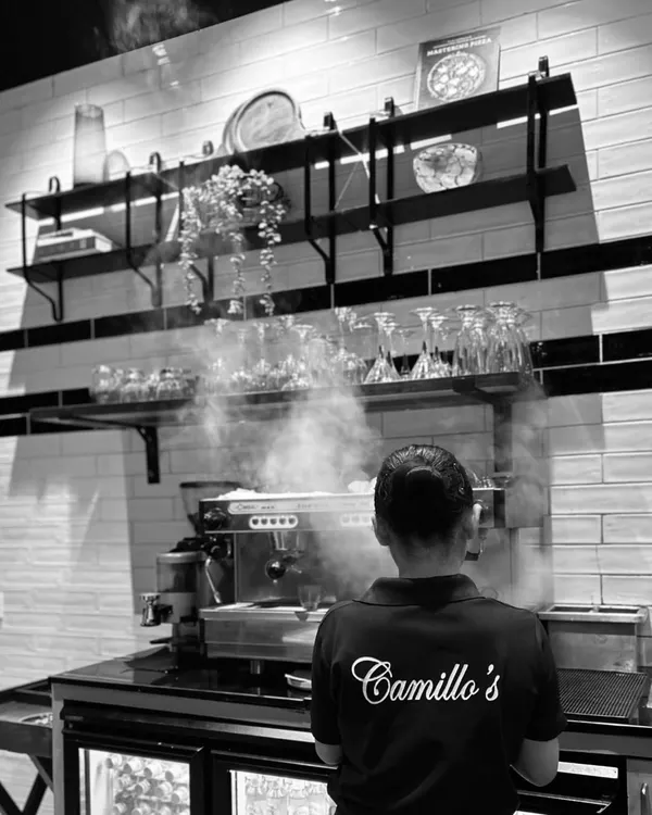 Here’s a glimpse of where your coffee is born. The steam rising from the espresso machine is a sign that something wonderful is brewing. It’s the heart of my artisanal coffee service.