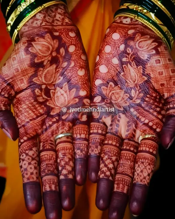 The beautiful result of organic henna and proper aftercare. This photo shows the deep, rich stain of a lotus-themed bridal design.