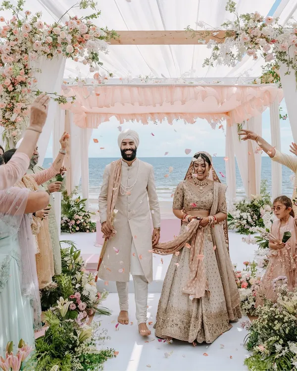 A perfect walk to remember. This is the moment every couple dreams of, and I make sure to capture it in all its glory, with family cheering and the ocean witnessing their union. This shot from a destination wedding in Thailand shows the joy and grandeur I bring to your big day.
