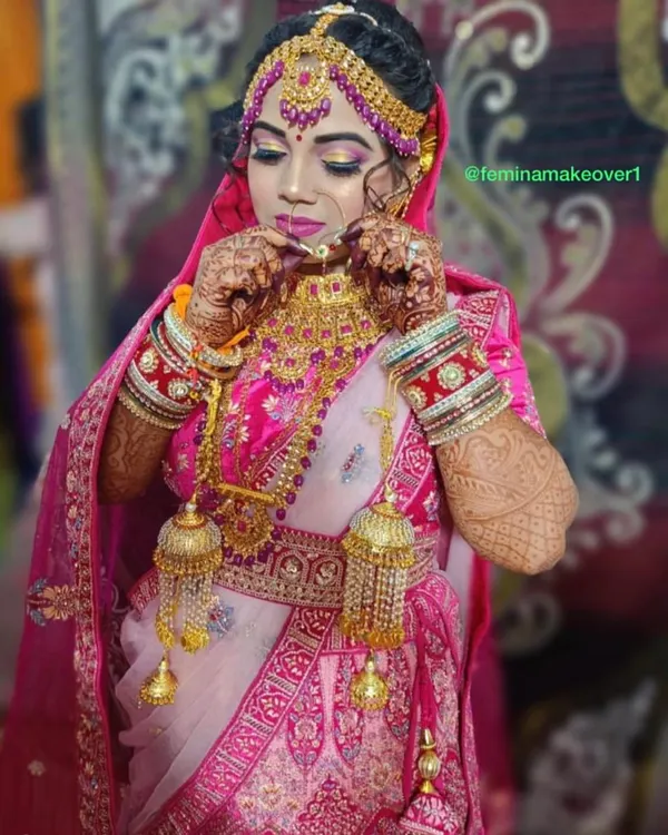 This is the complete bridal package. I focus on creating a flawless, radiant base with bold eyes and a classic red lip, ensuring the jewellery and outfit are perfectly complemented. The goal is a timeless look you will love in photos for years to come.