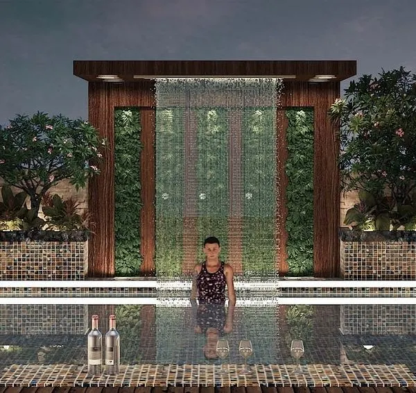 This is what we mean by luxury outdoor living. For this Lonavala villa, we designed and built a rooftop infinity pool complete with a rain curtain feature. We handled all the structural analysis to ensure the building could safely support the weight, creating a stunning escape with panoramic views.