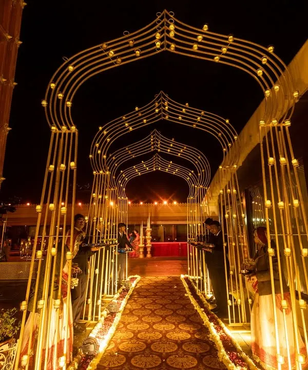 The first impression for your guests should be nothing short of magical. I designed this illuminated archway at Udaipur's Jagmandir Island Palace to create a grand, welcoming entrance that sets a tone of royal elegance for the entire destination wedding celebration.