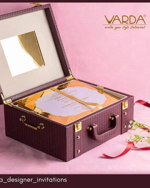 This anniversary invitation is designed as a sophisticated briefcase-style keepsake box. The rich, textured exterior and custom-fitted interior for the acrylic invite make it a truly luxurious and memorable announcement for a milestone celebration.
