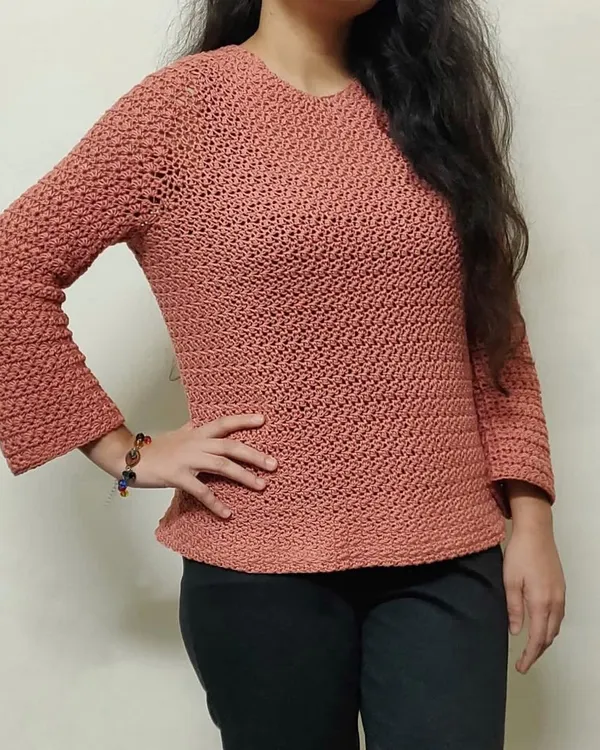 This is the Etoile Sweater, one of my favorite pieces to make. I love how it fits, and the star-stitch detail on the sleeves makes it so unique. We can create this custom handmade sweater for you in any color you like.
