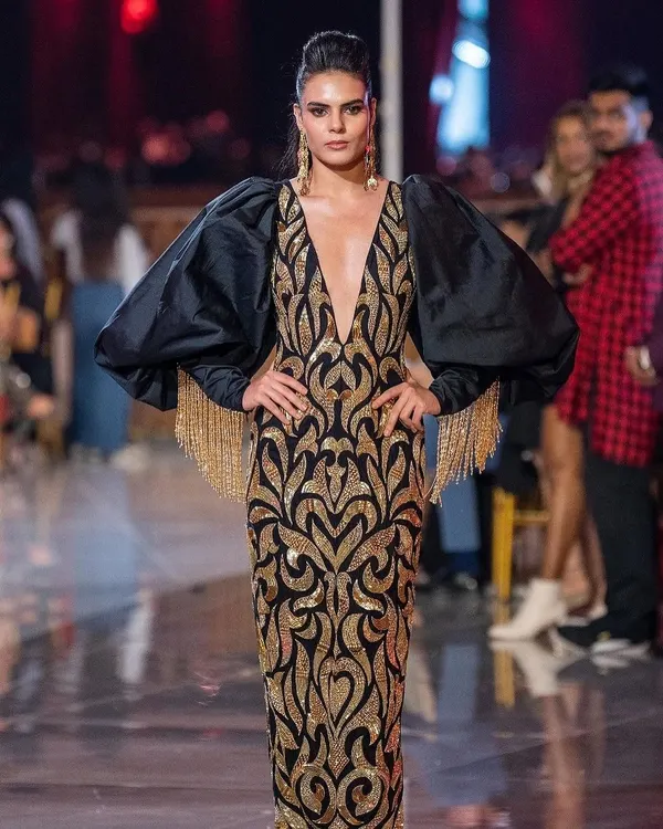 A powerful runway look for Abu Jani Sandeep Khosla at the Jio World Plaza launch. The makeup is bold and defined to match the dramatic silhouette of the gown, featuring sharp contouring and striking eyes.