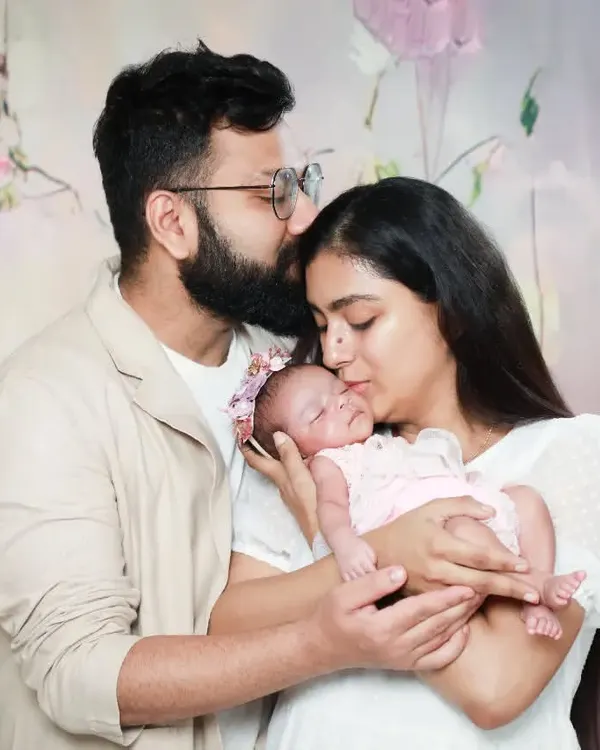 A family is where life begins and love never ends. This is such a tender moment between new parents and their precious baby.