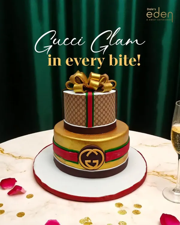 This is what I mean when I say your vibe is my starting point. This two-tier Gucci-themed cake features the iconic pattern and logo, complete with a gold bow, making it a true couture centerpiece for a stylish celebration.