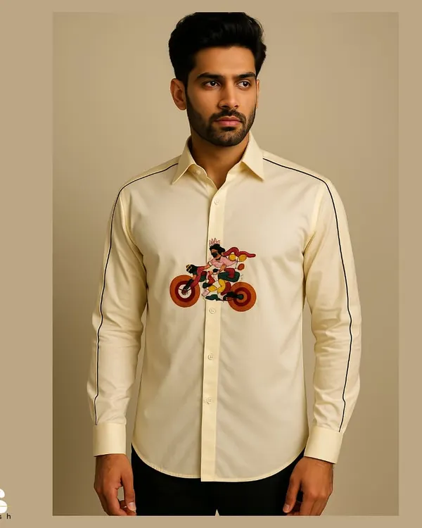 A full view of the custom cyclist shirt in a soft cream color. The colorful embroidery is perfectly placed for impact, while the black piping on the sleeves adds a sharp, modern contrast.