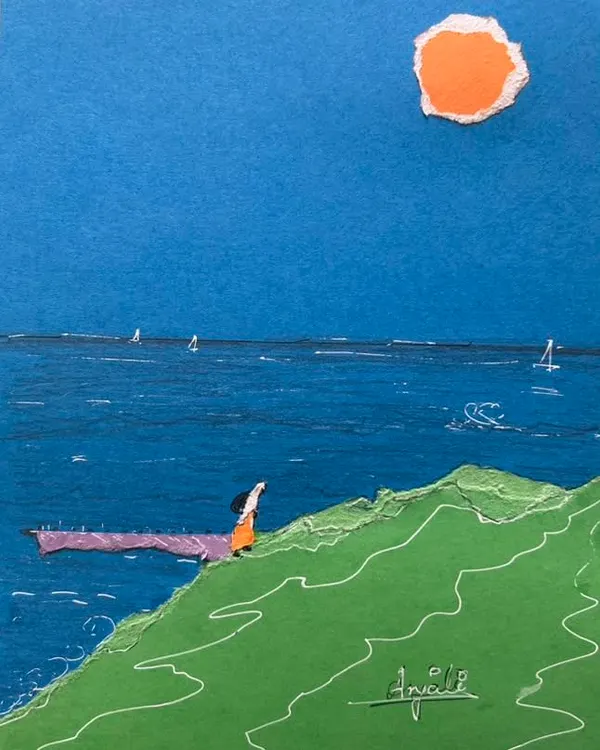A serene seascape created with torn paper collage. The different shades of blue paper form the ocean, while a simple figure looks out from a green hill, showing how simple shapes can create a powerful scene.