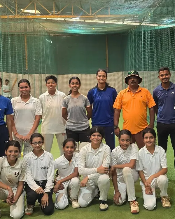 A snapshot of our dedicated girls' cricket team during a practice session in the nets. The focus and camaraderie here is what makes our academy special.