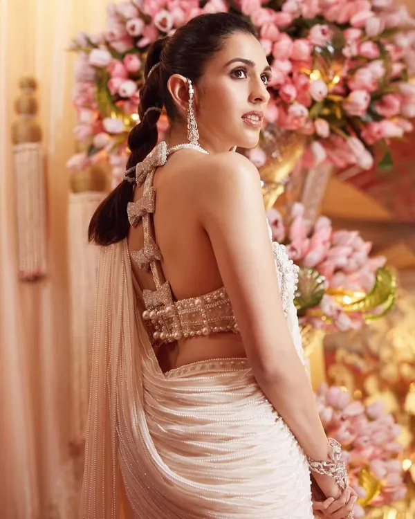 A close-up of the stunning back of the custom Tamara Ralph saree. The bow details and intricate beading are what make this piece so special and couture.