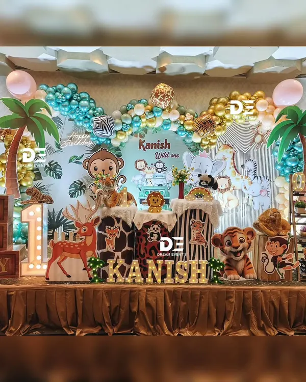 Welcome to the jungle! This vibrant safari theme is one of my most popular requests, featuring a full stage setup with a custom backdrop, lush balloon garlands, themed pedestals, and life-sized animal cutouts for a truly wild celebration.