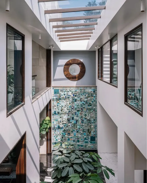 This 30-foot-high turquoise ceramic mural is the heart of the home. Located in a sunlit central courtyard, it was created in collaboration with an artist from Auroville and features motifs of everyday Indian objects. It’s a stunning piece of art that tells a story.