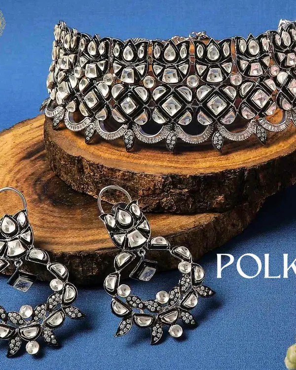 Why repeat when you can rent? This stunning Polki choker and earring set with a modern black finish is perfect for making a bold statement at a cocktail party or reception.