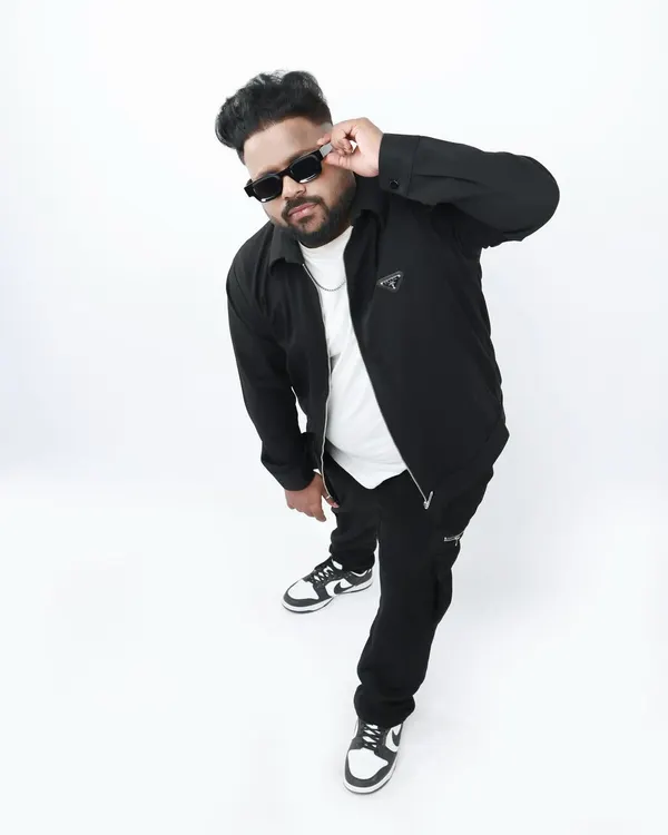 A high-angle shot from a professional studio photoshoot. This is part of building my brand, presenting a cool and confident image that matches the energy of my music.
