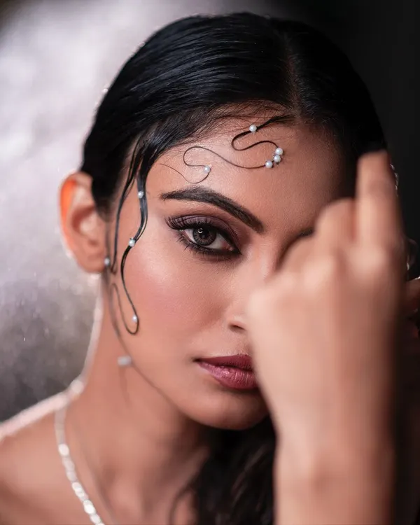 A fine art portrait where water and pearls become part of the story. This wet-look concept is about creating something visually poetic and unconventional, pushing the boundaries of a standard beauty shot.