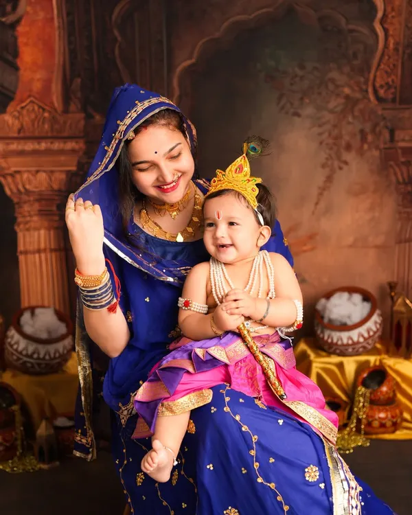 A beautiful moment between an older sister as Yashoda and her baby brother as little Krishna. Capturing sibling love during a festive Janmashtami shoot is truly special.
