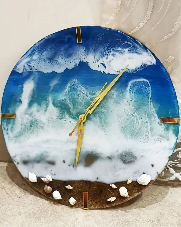 This custom resin wall clock captures the serene beauty of the ocean, complete with realistic wave effects and actual seashells embedded at the base. It's a functional piece of art that brings a calming, coastal vibe to any room.